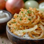 A bowl of crispy sour cream and onion chips with visible seasoning