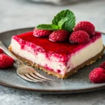 Slice of Raspberry Cheesecake Bliss served on a plate.